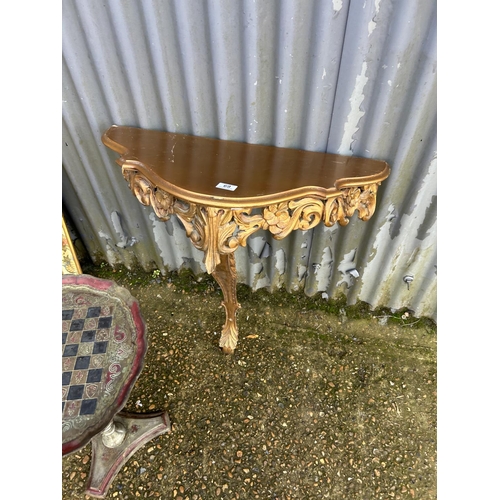 69 - Floral wall mirror, gold gilt hall table and an occasional table