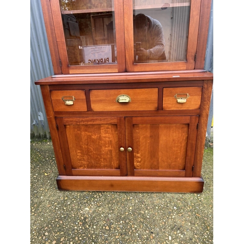 85 - A modern dresser by LAURA ASHLEY with glazed top over three drawer and two door base 110x46x190