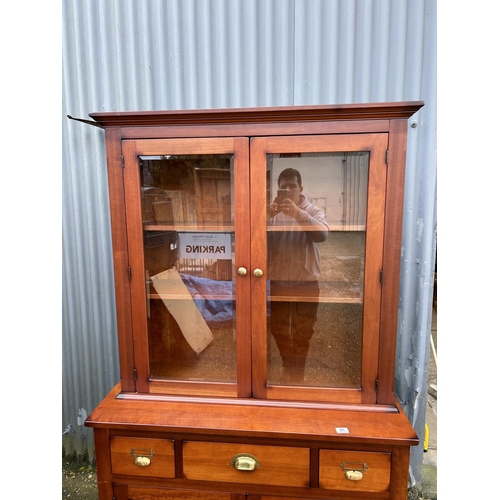 85 - A modern dresser by LAURA ASHLEY with glazed top over three drawer and two door base 110x46x190