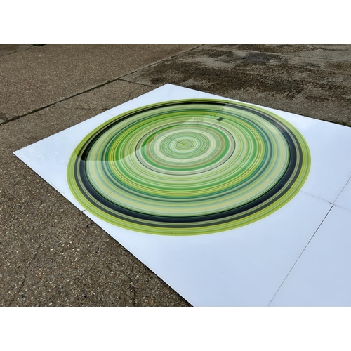 88 - A very large Perspex modern wall art of a green and black circle, made up of four Perspex panels tot... 