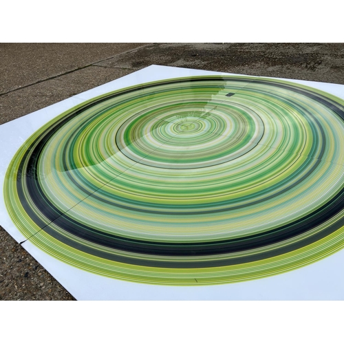 88 - A very large Perspex modern wall art of a green and black circle, made up of four Perspex panels tot... 