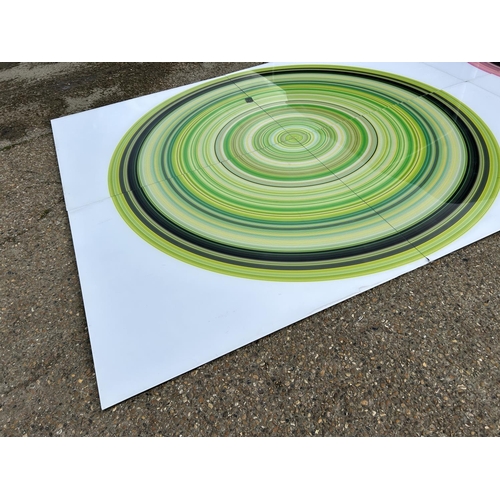 88 - A very large Perspex modern wall art of a green and black circle, made up of four Perspex panels tot... 