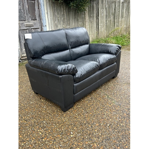 9 - As new ex shop display black leather effect two seater sofa, 160 wide