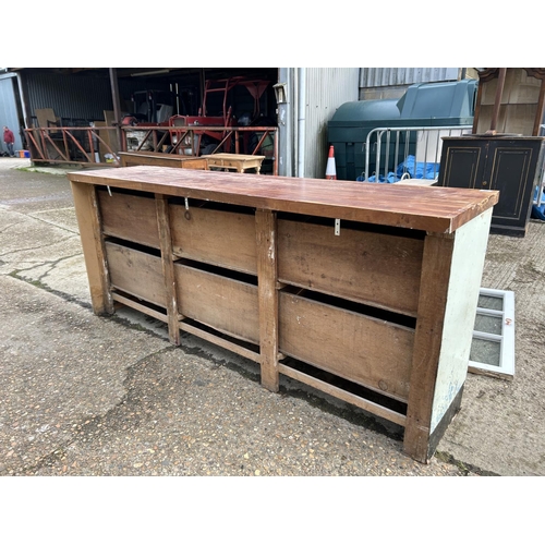 98 - A large antique painted pine six drawer dresser base, fitted with later worktop and painted, with gl... 