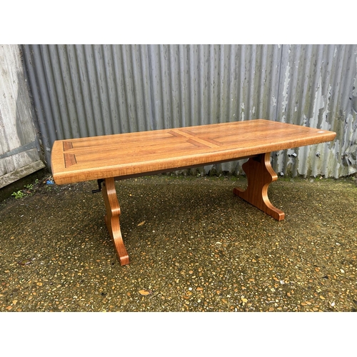 100A - Mid century teak height adjusting table with wind up mechanism labelled to underside Emu