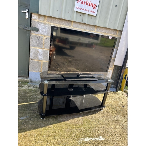 200J - Sony flat screen tv on black glass stand