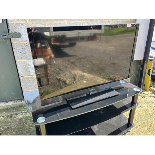 200J - Sony flat screen tv on black glass stand