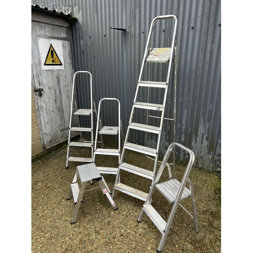 102 - A collection of five aluminium step ladders