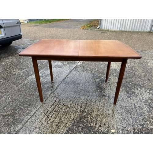 109 - A meredew teak extending dining table with leaf  max size 180x82x70