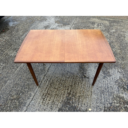 109 - A meredew teak extending dining table with leaf  max size 180x82x70