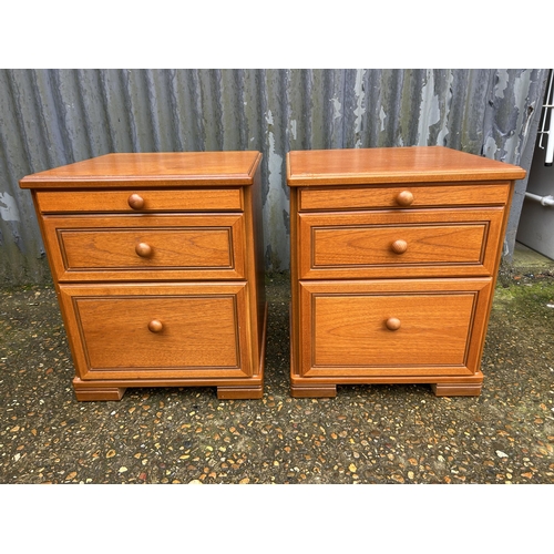 110 - A pair of stag teak three drawer bedsides