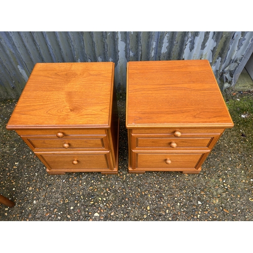 110 - A pair of stag teak three drawer bedsides