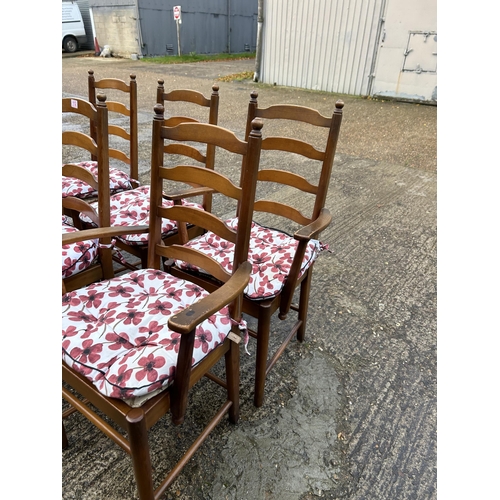 112 - A set of six dark ercol ladder back dining chairs