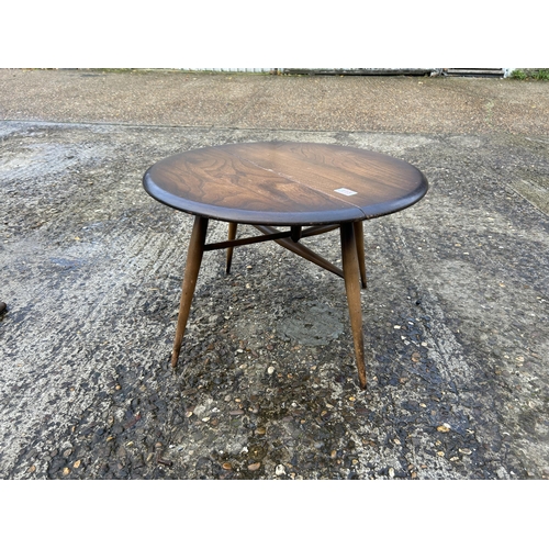 113 - A dark ercol drop leaf coffee table