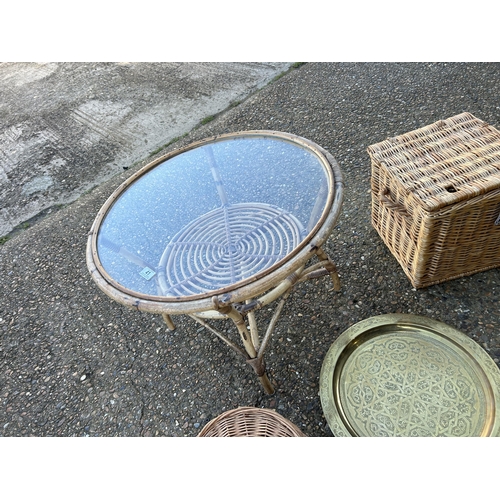 125 - A bamboo coffee tables two wicker baskets and a brass plaque