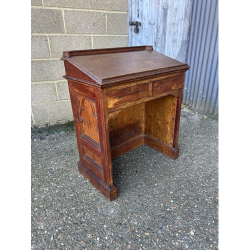 134 - An oak church lectern with two pull out book slides 76x47x90