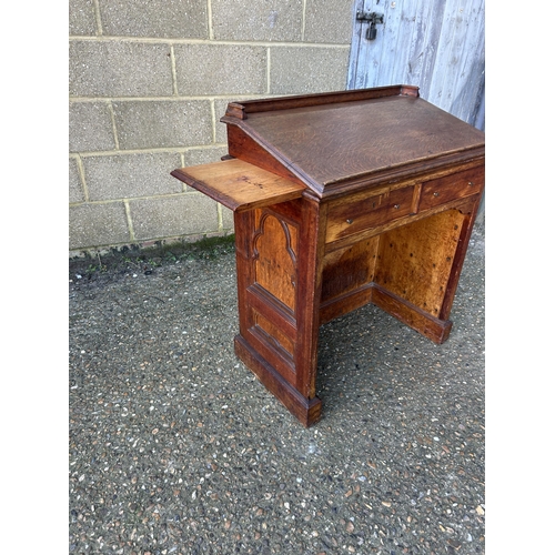 134 - An oak church lectern with two pull out book slides 76x47x90