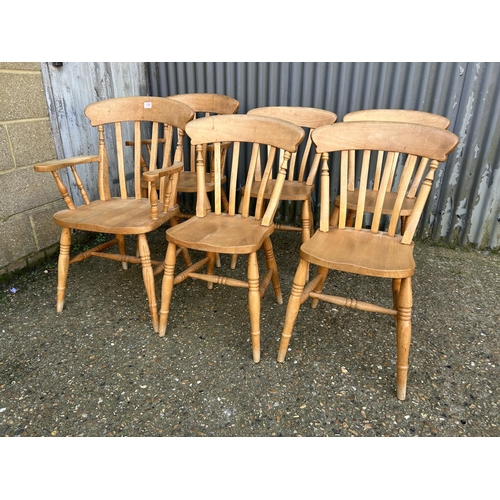 139 - A set of six pine dining chairs inc 2 carvers