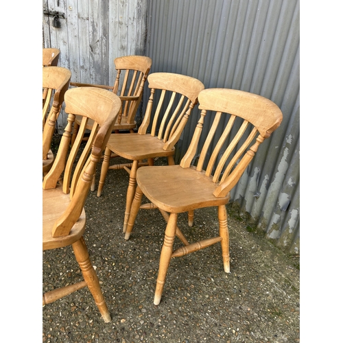 139 - A set of six pine dining chairs inc 2 carvers