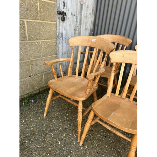 139 - A set of six pine dining chairs inc 2 carvers