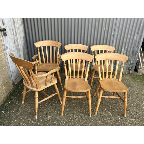 139 - A set of six pine dining chairs inc 2 carvers