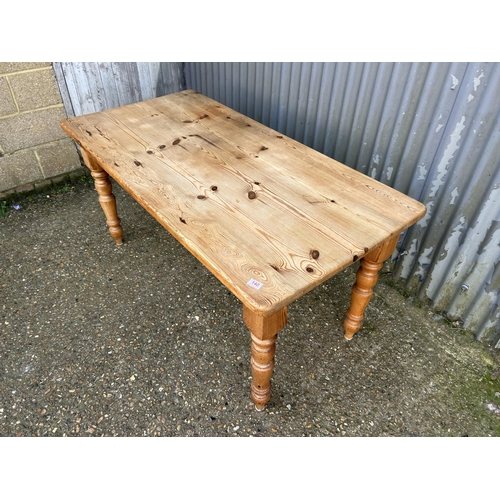 140 - A solid pine dining table 152x72x75