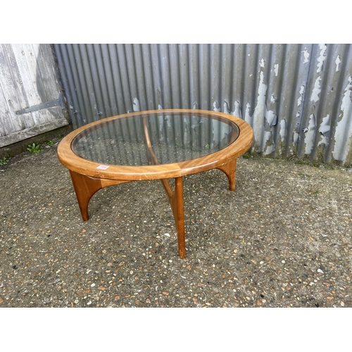 149 - A mid century teak coffee table with drop in glass top