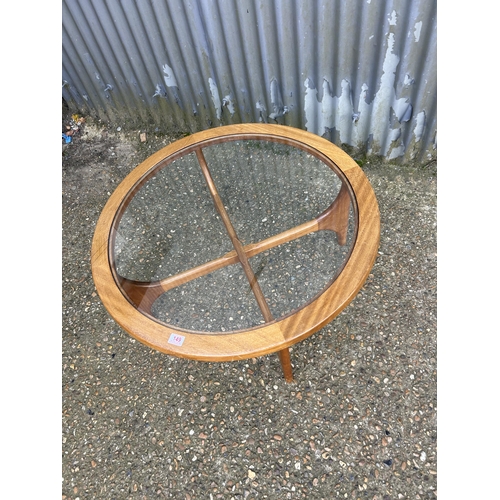 149 - A mid century teak coffee table with drop in glass top