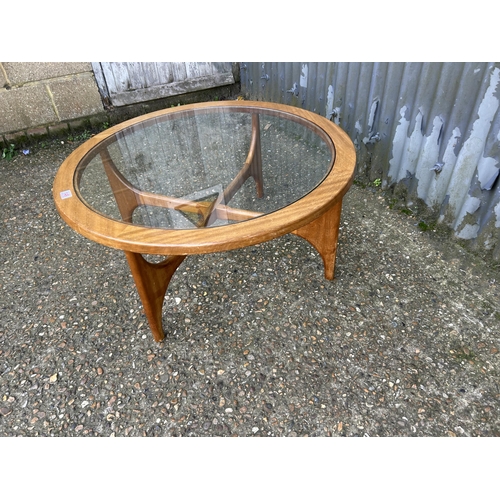 149 - A mid century teak coffee table with drop in glass top