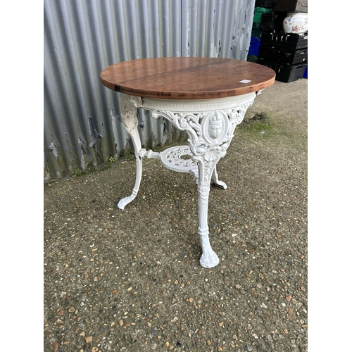 152 - An iron based Britannia table with white painted iron base  67cm diameter