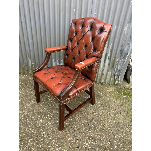 153 - A red leather chesterfield Gainsborough chair