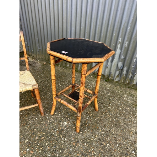 154 - A vintage bamboo table together with rush seat