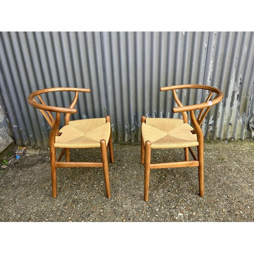 158 - A pair of bow back dining chairs