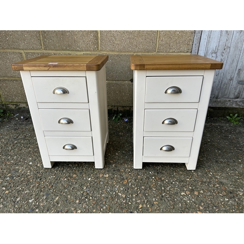 160 - A pair of painted light oak three drawer bedsides