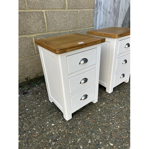 160 - A pair of painted light oak three drawer bedsides