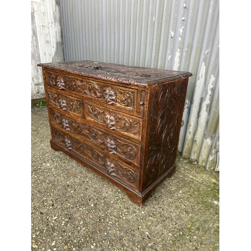 162 - A carved oak chest of drawers 108x50x80