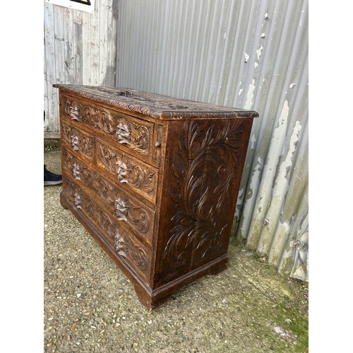 162 - A carved oak chest of drawers 108x50x80