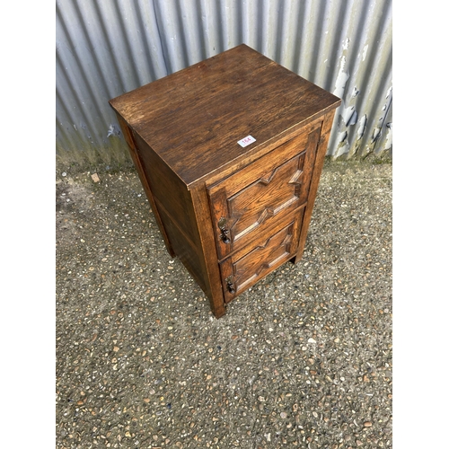 164 - An oak two door record cupboard