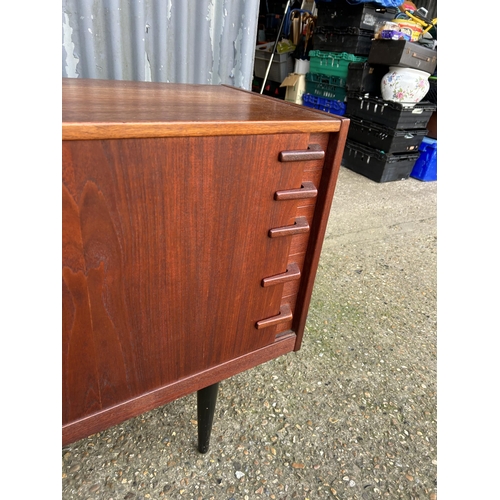 167 - A mid century danish sideboard labelled HUGO TROEADS  150x40x80