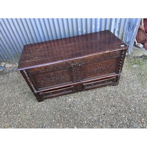 17 - A carved oak mule chest 128x57x57