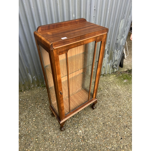 173 - A mahogany single door cabinet with two glass shelves