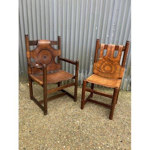 174 - A pair of Norwegian style chairs with thick brown leather (one carver);