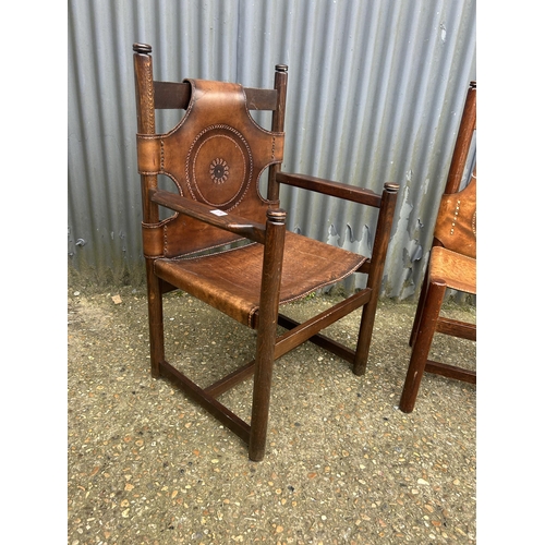 174 - A pair of Norwegian style chairs with thick brown leather (one carver);