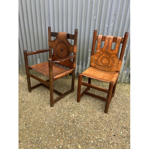 174 - A pair of Norwegian style chairs with thick brown leather (one carver);