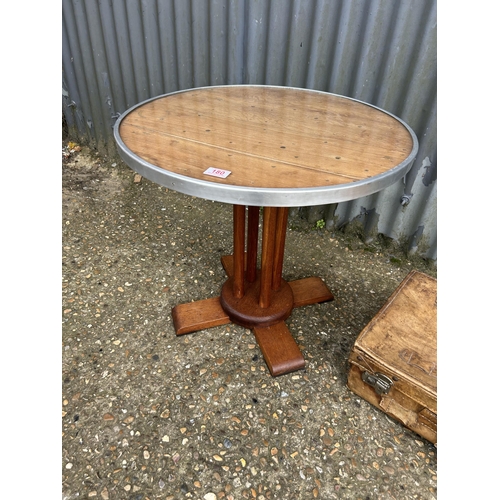 180 - A deco style circular occasional table, together vintage leather suitcase