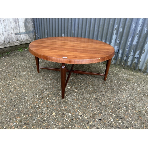 184 - A mid century teak circular coffee table marked WEBE 100cm diameter