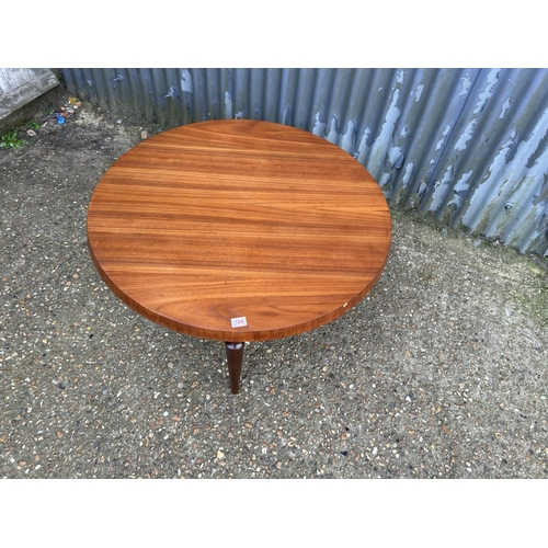 184 - A mid century teak circular coffee table marked WEBE 100cm diameter