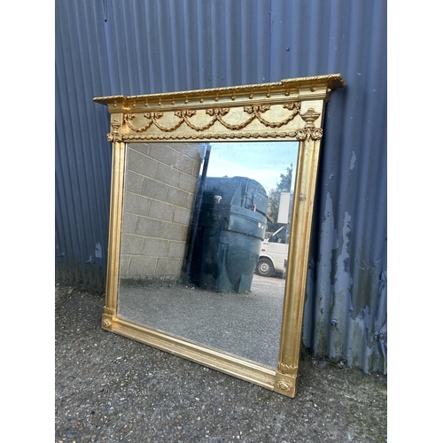 188 - A large gold gilt overmantle mirror 130x130