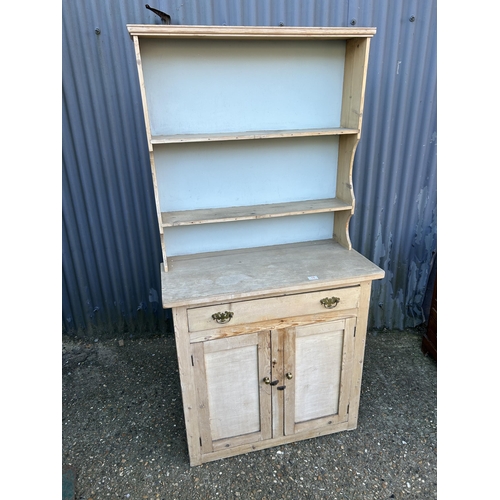 19 - A small stripped pine dresser 90cm wide