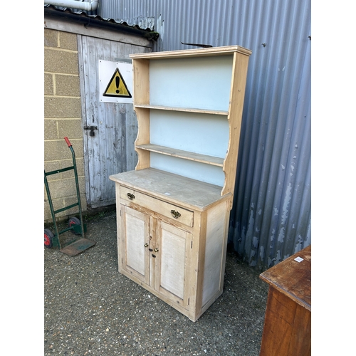 19 - A small stripped pine dresser 90cm wide